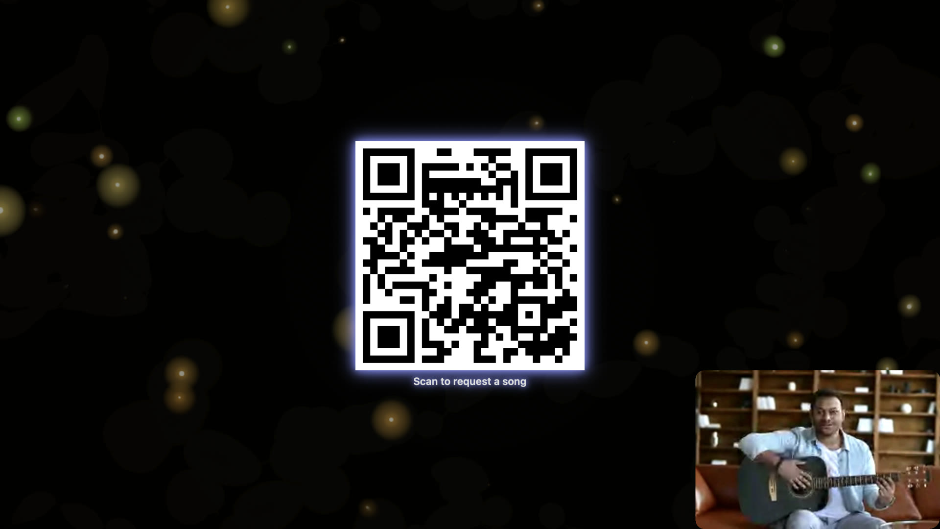 A QR code on the stage captioned Scan to request a song, with a guitarist in the corner